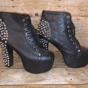 Platform heeled lace-up bootie.